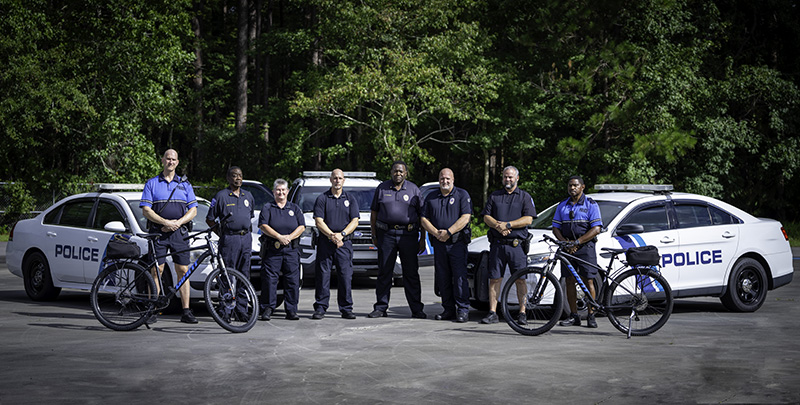 FSCJ police standing in front of police cars.