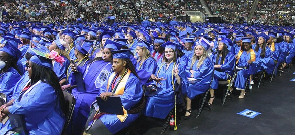 Graduates sitting in chairs